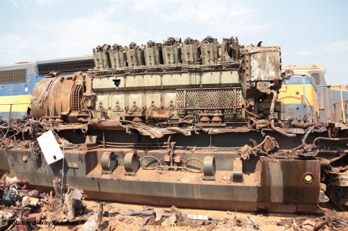 141027 5891
Wedgefield, Sell and Parker's metal recycling yard, General Electric AC6000 unit 6071 serial 51063 6600 hp GEVO-16 motor and GE 5GMG201 alternator awaiting the thermal lance.
Keywords: 6071;GE;AC6000;51063;