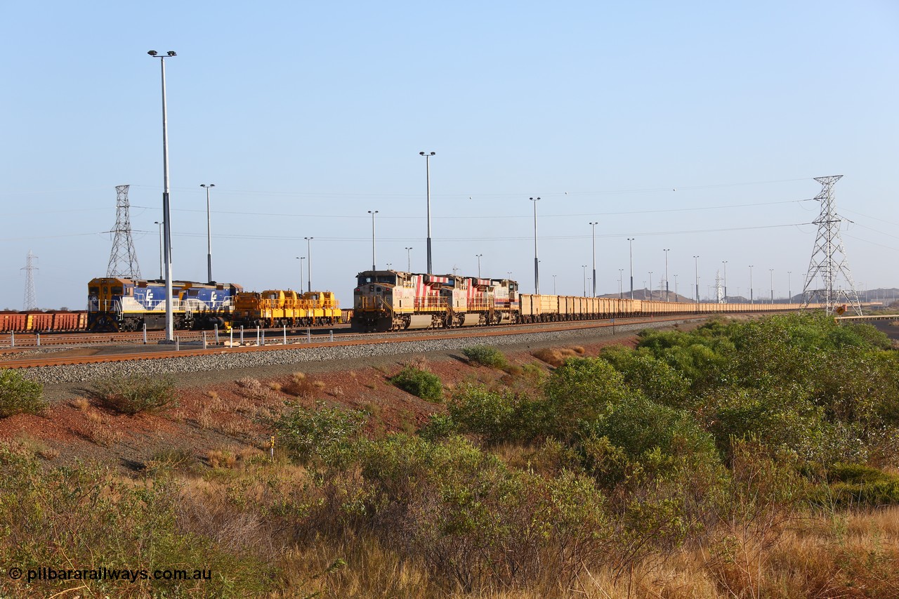 151111 9483
Cape Lambert Yard, empty train with motive power of General Electric ES44DCi units 8160 and 8193 serials 60224 and 61852 and General Electric Dash 9-44CW 7074 serial 47743 waiting to depart with leased CFCLA CD class shunt units CD 4302 and CD 4305 and compressor car sets CB 13 and CB 16.
Keywords: 8160;GE;ES44DCi;60224;