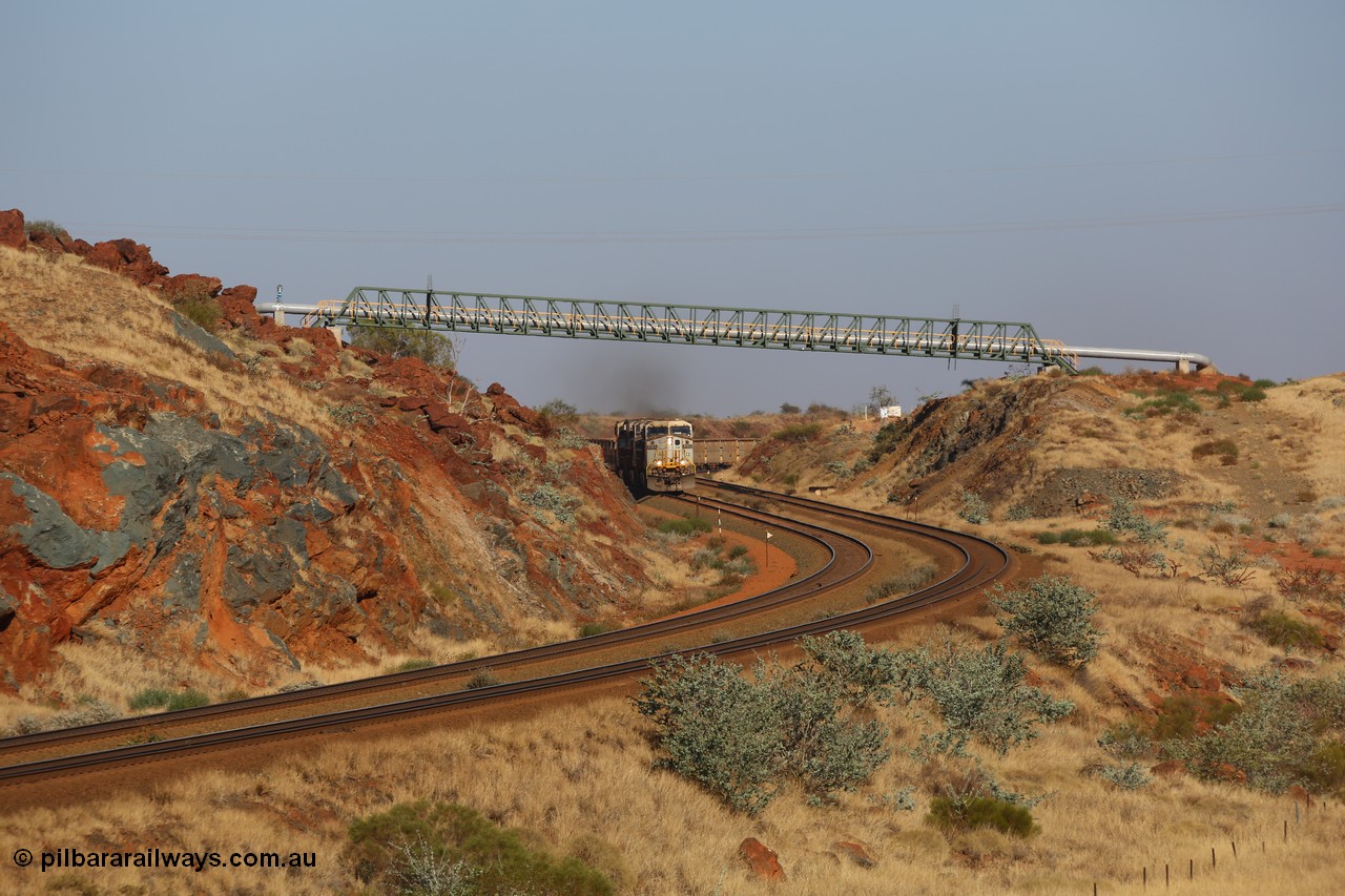 151111 9485
Near the 38 km post, an empty train lead by General Electric ES44DCi units 8160 and 8193 serials 60224 and 61852 and General Electric Dash 9-44CW 7074 serial 47743 power under the water supply pipeline on the Cape Lambert line.
Keywords: 8160;GE;ES44DCi;60224;