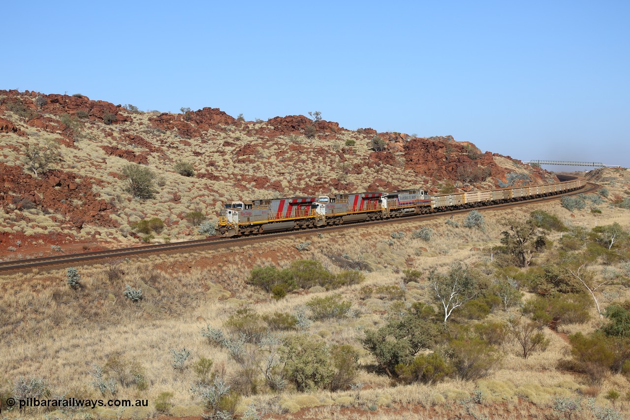 151111 9493
Near the 38 km post, an empty train lead by General Electric ES44DCi units 8160 and 8193 serials 60224 and 61852 and General Electric Dash 9-44CW 7074 serial 47743 power under the water supply pipeline on the Cape Lambert line.
Keywords: 8160;GE;ES44DCi;60224;