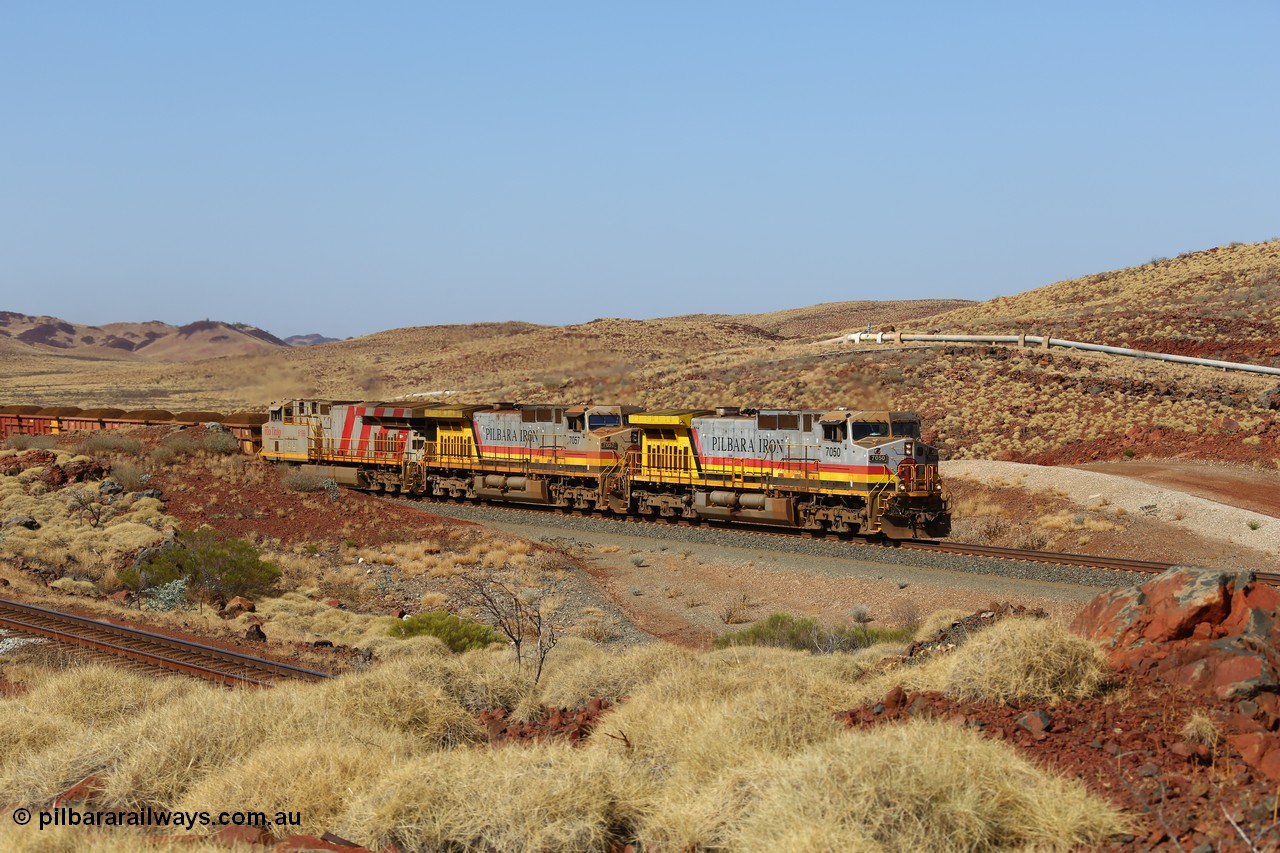 151111 9502
At the 47 km post on the Cape Lambert line a loaded train runs along on the West Mainline behind 7050 and 7057 both General Electric Dash 9-44CW units with serials of 57101 and 55882 and the last General Electric ES44DCi 8199, serial 61858.
Keywords: 7050;GE;Dash-9-44CW;57101;