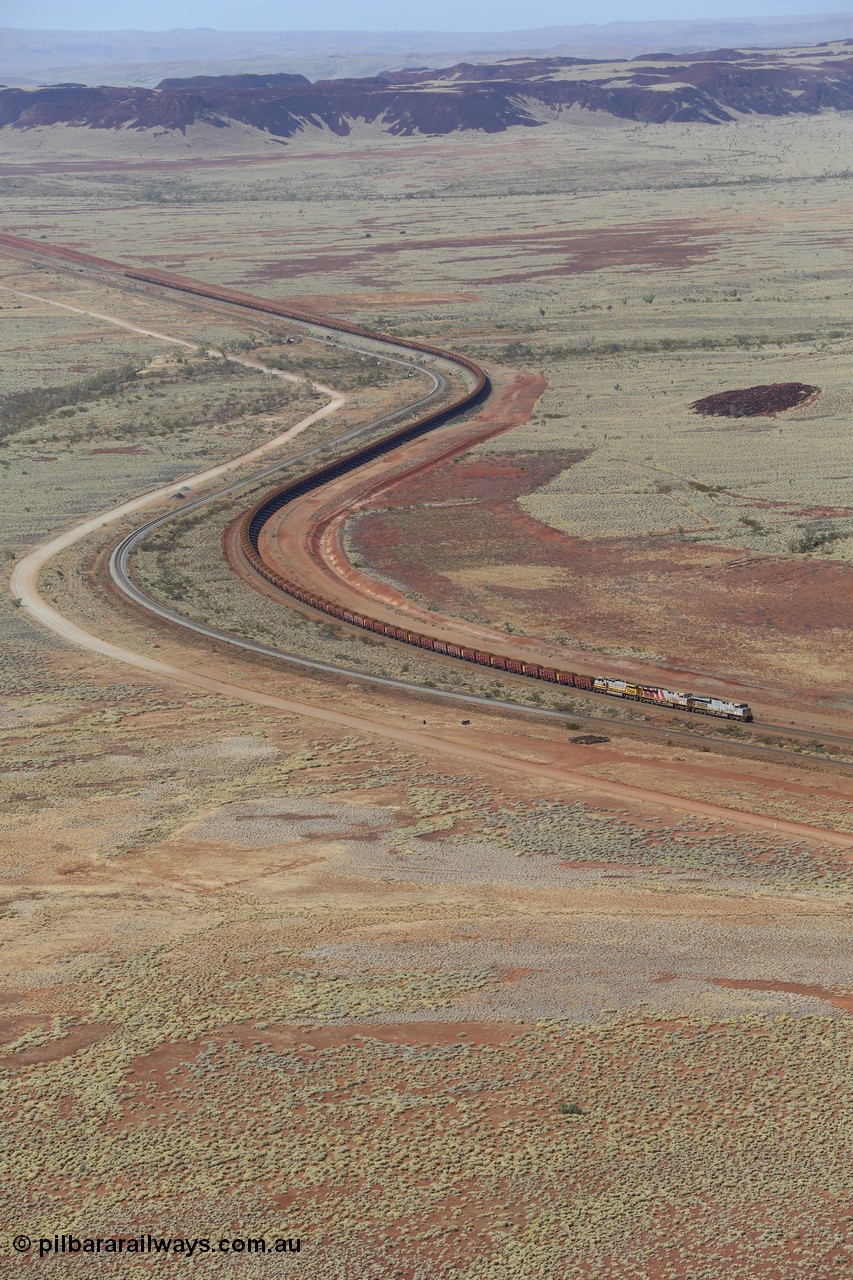 151111 9514
A loaded train behind General Electric ES44DCi units 8113 serial 59105 in the original silver livery and 8145 serial 58726 in the tiger strip Rio livery and Dash 9-44CW 9433 serial 54766 in ROBE Pilbara Iron livery runs along on the West Mainline bound for Cape Lambert viewed from Table Hill.
Keywords: 8113;GE;ES44DCi;59105;