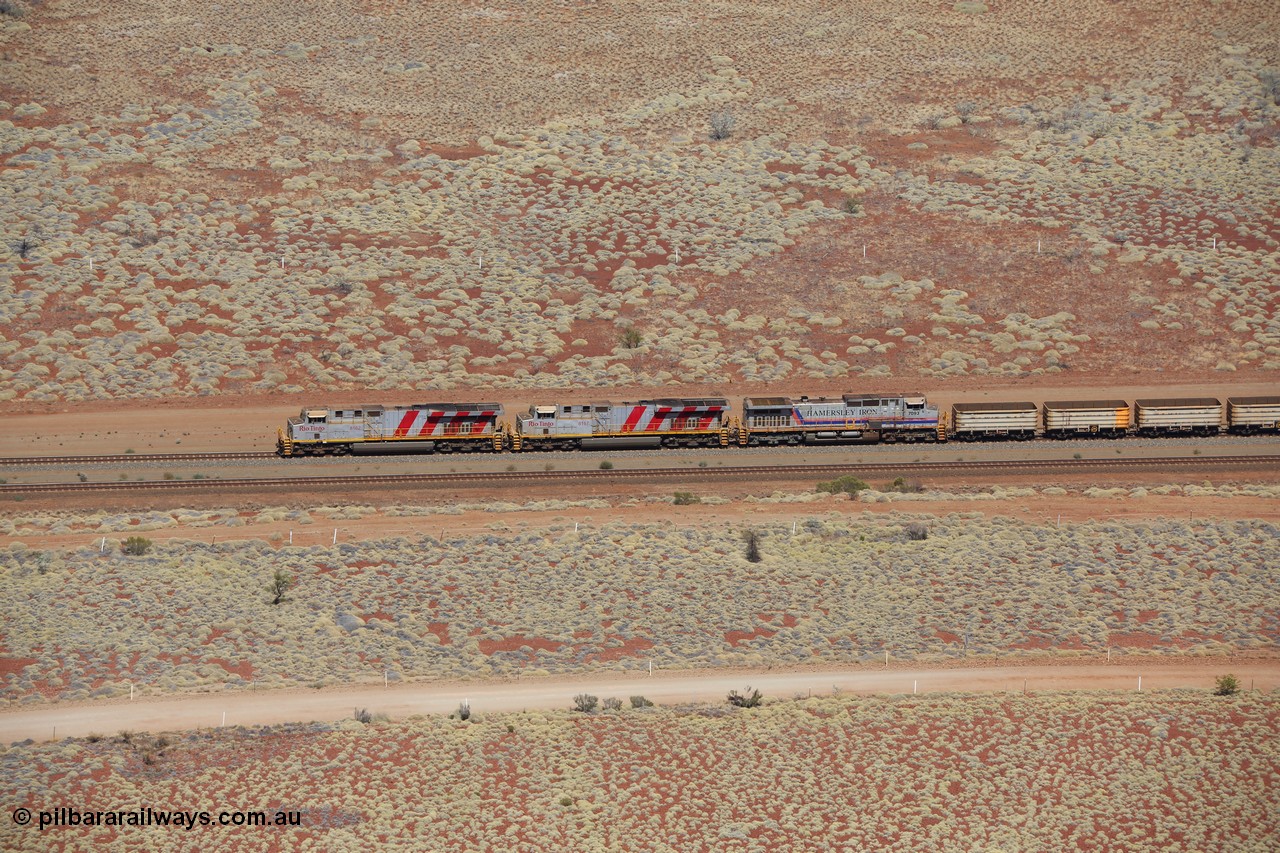 151111 9547
Side view of empty train led by General Electric ES44DCi units 8162 serial 60226 and 8167 serial 60231 both in the Rio Tinto tiger strip livery leading Dash 9-44CW 7093 serial 47772, the last of the original build of Dash 9 units at the 53 km.
Keywords: 8162;GE;ES44DCi;60226;