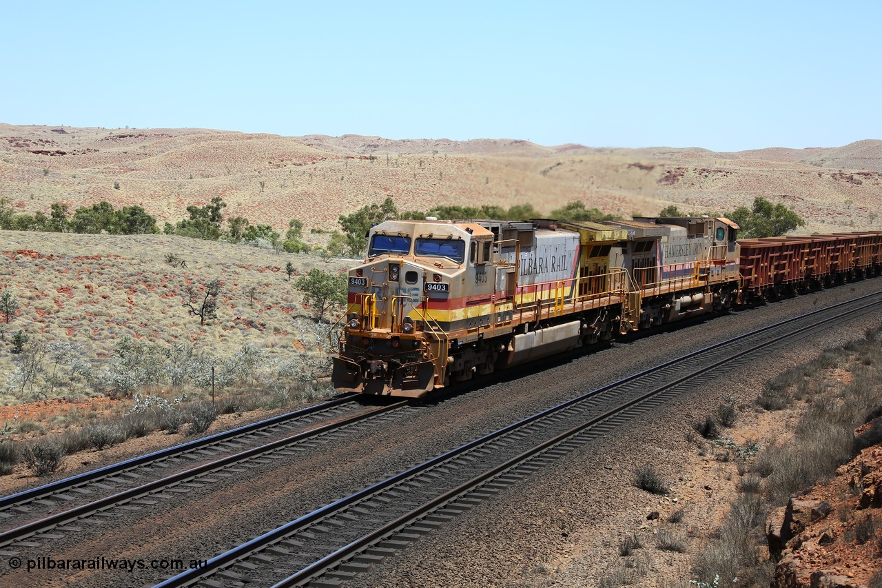 151111 9570
An empty train struggles upgrade at the 87.5 km post on the Tom Price line behind double General Electric Dash 9-44CW units 9403 serial 53457 wearing ROBE Pilbara Rail livery and 7087 serial 47766 wearing the original Hamersley Iron livery.
Keywords: 9403;GE;Dash-9-44CW;53457;