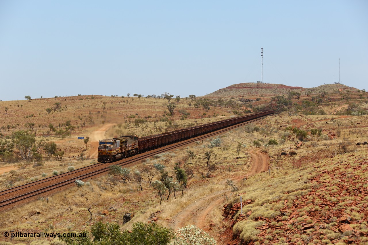 151111 9574
An empty train is still struggling upgrade at the 98 km post on the Tom Price line behind double General Electric Dash 9-44CW units 9403 serial 53457 wearing ROBE Pilbara Rail livery and 7087 serial 47766 wearing the original Hamersley Iron livery.
Keywords: 9403;GE;Dash-9-44CW;53457;