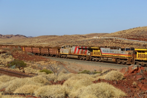 151111 9503
At the 47 km post on the Cape Lambert line a loaded train runs along on the West Mainline, 7057 a General Electric Dash 9-44CW unit with serial of 55882 and the last General Electric ES44DCi 8199, serial 61858.
Keywords: 7057;GE;Dash-9-44CW;55882;