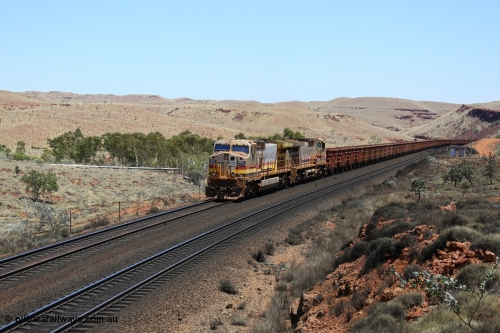 151111 9568
An empty train struggles upgrade at the 87.5 km post on the Tom Price line behind double General Electric Dash 9-44CW units 9403 serial 53457 wearing ROBE Pilbara Rail livery and 7087 serial 47766 wearing the original Hamersley Iron livery.
Keywords: 9403;GE;Dash-9-44CW;53457;