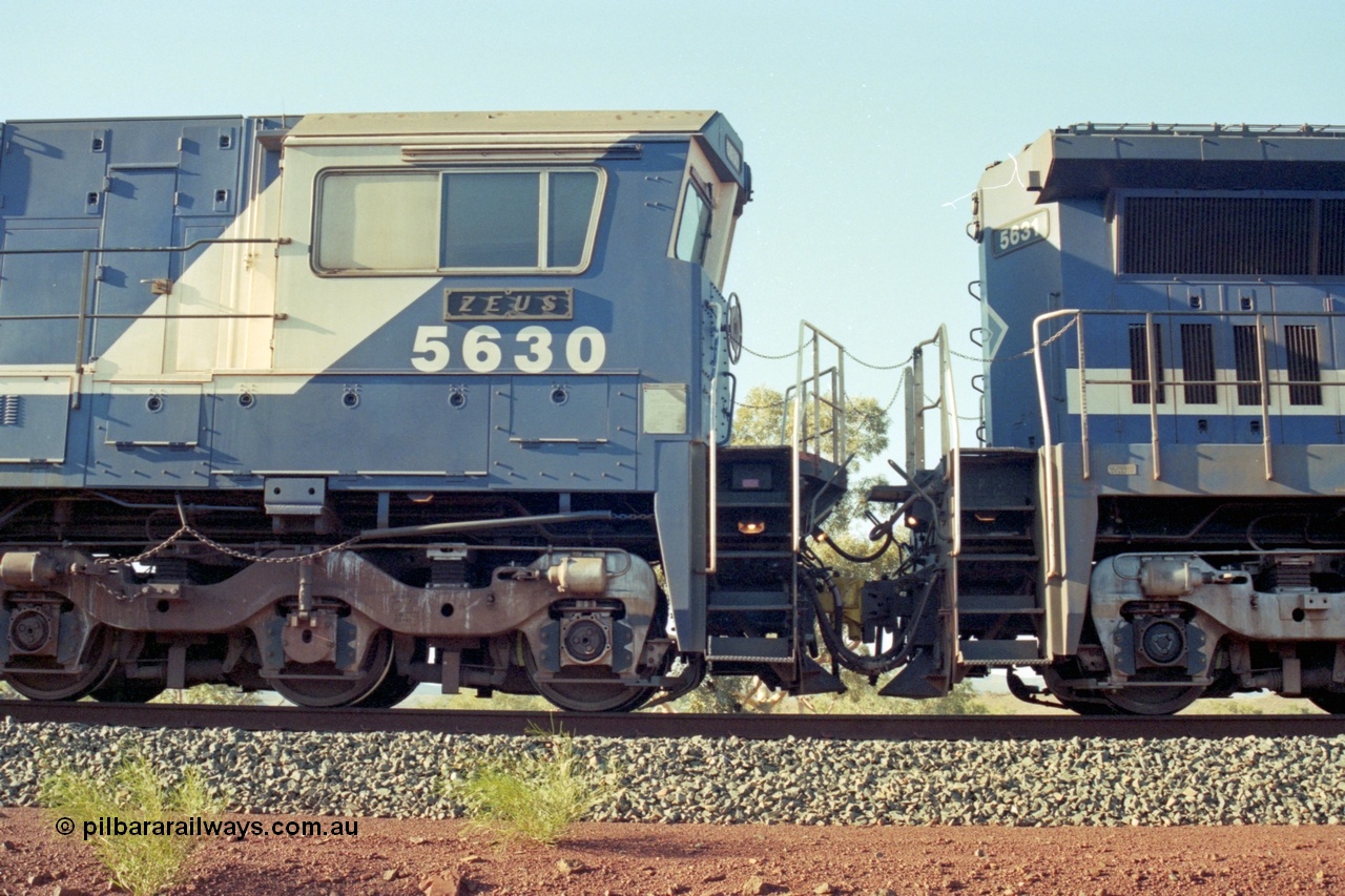 196-08
Yandi Two, BHP Iron Ore 5630 'Zeus' serial 5831-09 / 88-079 originally built new by Goninan as a GE CM39-8 in 1988. Drivers side cab view shows hand brake chain and bogie. May 1998.
Keywords: 5630;Goninan;GE;CM39-8;5831-09/88-079;