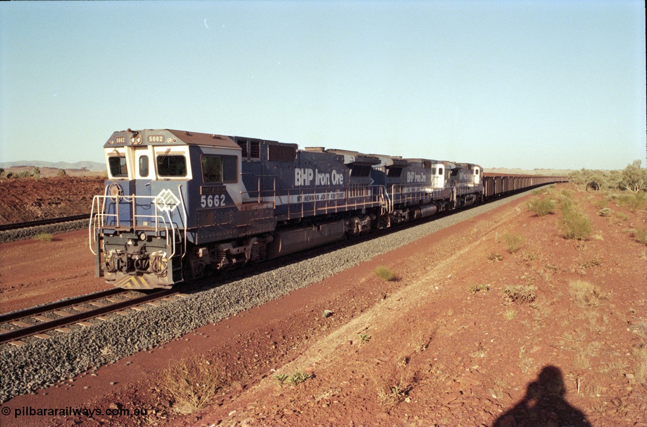 196-16
Yandi Two loaded car side of the loadout balloon loop, loaded train departing behind BHP Iron Ore triple CM40-8M units, 5662 'Port Kembla' serial 8412-07 / 94-153 rebuilt by Goninan in 1994 from Comeng NSW built ALCo M636C #5490 serial C6084-6 from 1974, leading two similar sister units. May 1998.
Keywords: 5662;Goninan;GE;CM40-8M;8412-07/94-153;rebuild;Comeng-NSW;ALCo;M636C;5490;C6084-6;