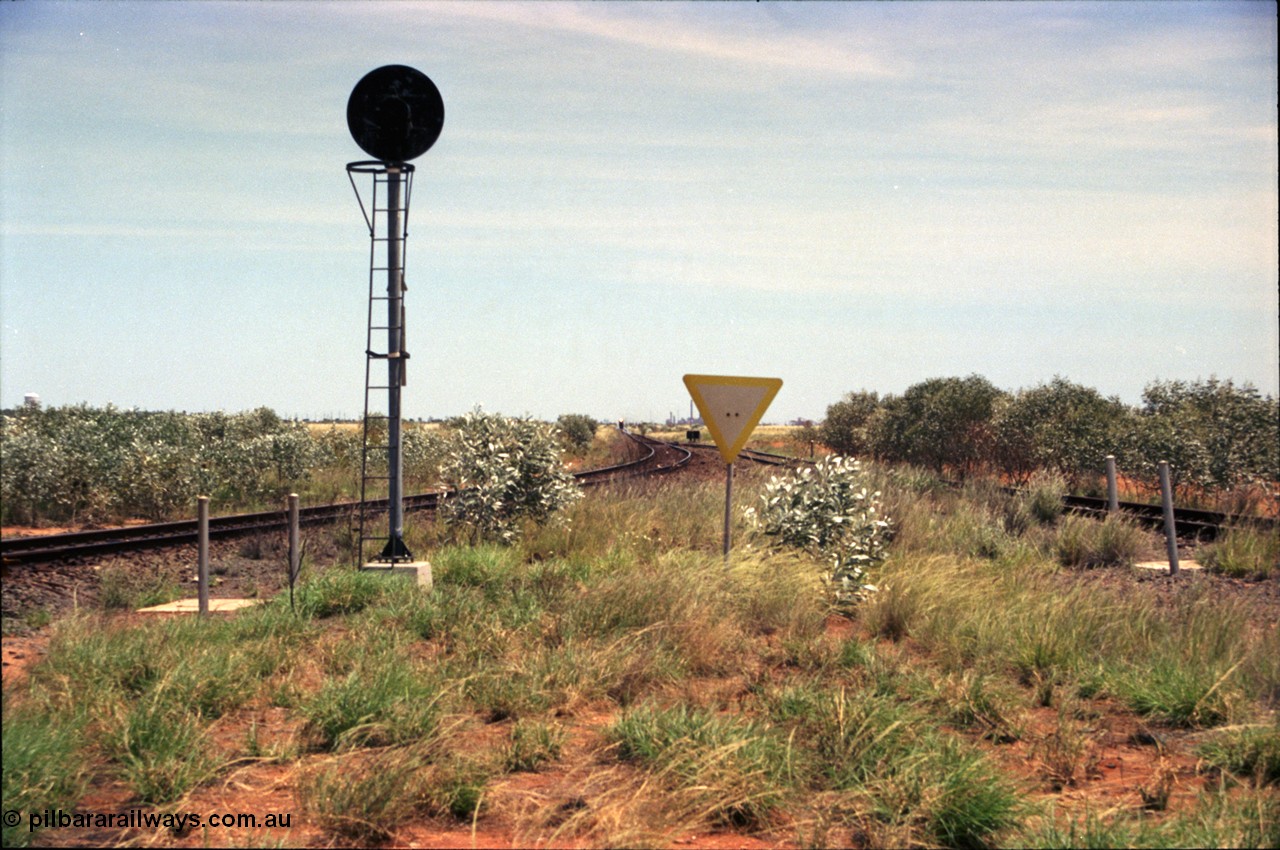 197-01
Goldsworthy Junction, looking west with the end of the triangle or wye, signal post is GJ 7, empty iron ore train on approach.
