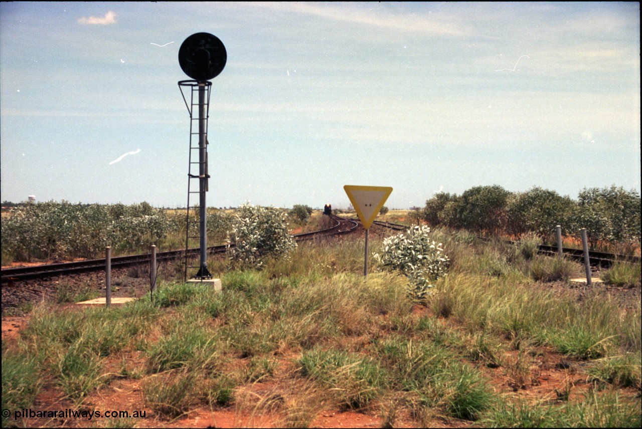 197-02
Goldsworthy Junction, looking west with the end of the triangle or wye, signal post is GJ 7, empty iron ore train on approach.
