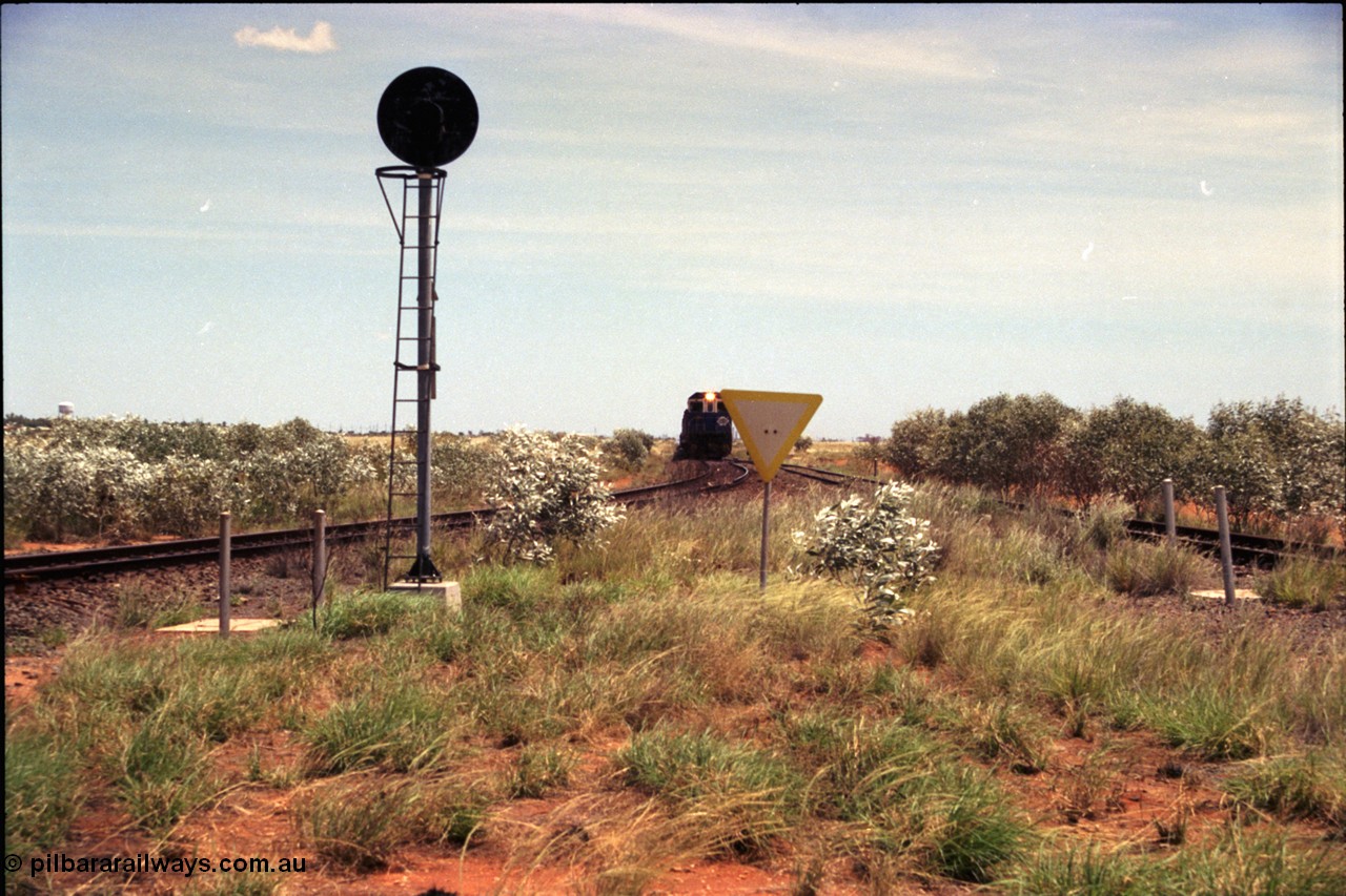 197-03
Goldsworthy Junction, looking west with the end of the triangle or wye, signal post is GJ 7, empty iron ore train on approach.
