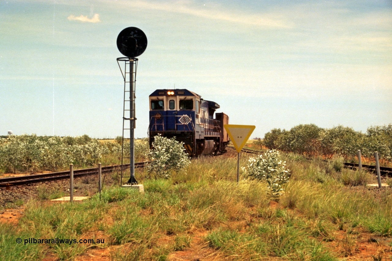 197-05
Goldsworthy Junction, looking west with the end of the triangle or wye, signal post is GJ 7, empty iron ore train behind BHP's Goninan 1988 build GE CM39-8 unit 5632 'Poseidon' serial 5831-11 / 88-081.
Keywords: 5632;Goninan;GE;CM39-8;5831-11/88-081;