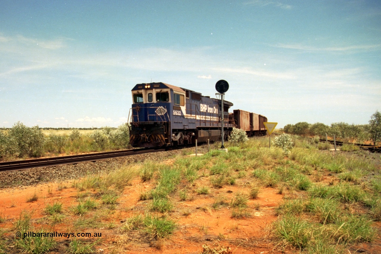 197-06
Goldsworthy Junction, looking west with the end of the triangle or wye, signal post is GJ 7, empty iron ore train behind BHP's Goninan 1988 build GE CM39-8 unit 5632 'Poseidon' serial 5831-11 / 88-081.
Keywords: 5632;Goninan;GE;CM39-8;5831-11/88-081;