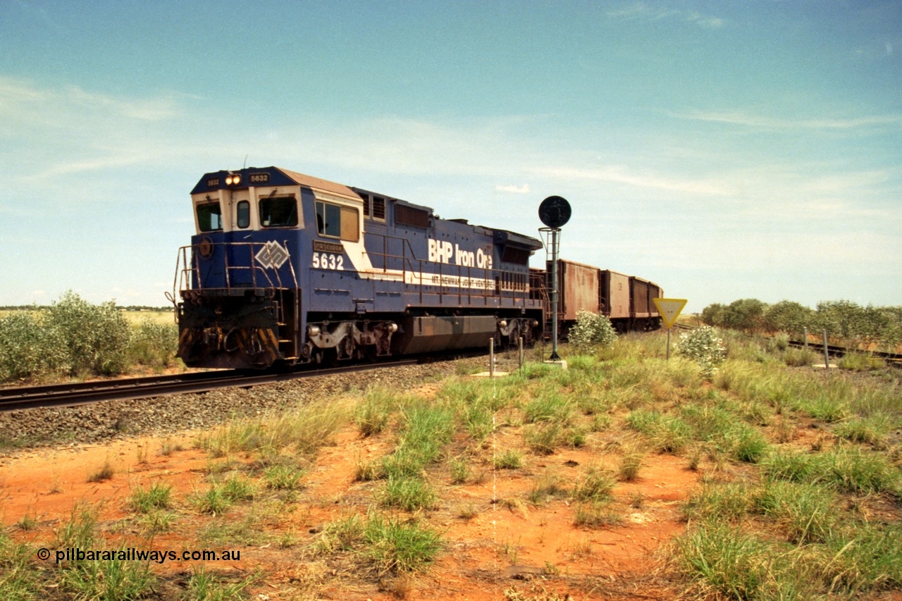 197-07
Goldsworthy Junction, looking west with the end of the triangle or wye, signal post is GJ 7, empty iron ore train behind BHP's Goninan 1988 build GE CM39-8 unit 5632 'Poseidon' serial 5831-11 / 88-081.
Keywords: 5632;Goninan;GE;CM39-8;5831-11/88-081;