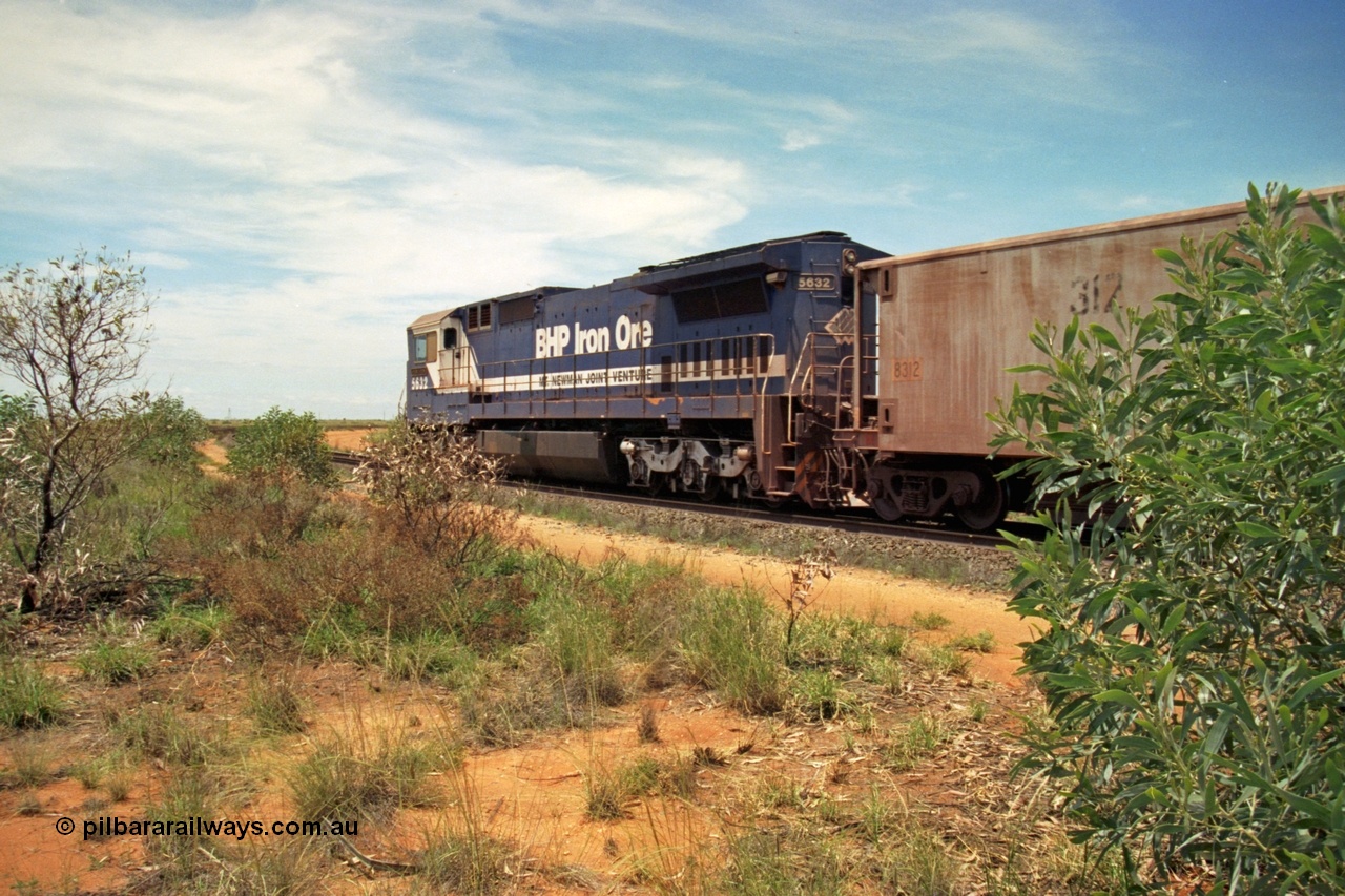 197-08
Goldsworthy Junction, looking east, empty iron ore train behind BHP's Goninan 1988 build GE CM39-8 unit 5632 'Poseidon' serial 5831-11 / 88-081, note the CCTV camera mounted under the radiator wing.
Keywords: 5632;Goninan;GE;CM39-8;5831-11/88-081;