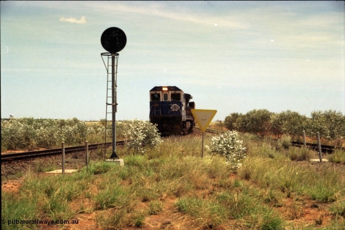 197-04
Goldsworthy Junction, looking west with the end of the triangle or wye, signal post is GJ 7, empty iron ore train behind BHP's Goninan 1988 build GE CM39-8 unit 5632 'Poseidon' serial 5831-11 / 88-081.
Keywords: 5632;Goninan;GE;CM39-8;5831-11/88-081;