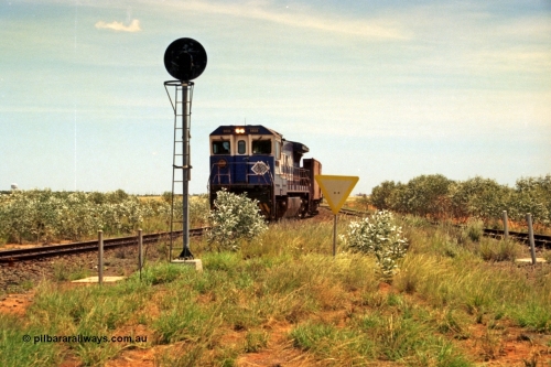 197-05
Goldsworthy Junction, looking west with the end of the triangle or wye, signal post is GJ 7, empty iron ore train behind BHP's Goninan 1988 build GE CM39-8 unit 5632 'Poseidon' serial 5831-11 / 88-081.
Keywords: 5632;Goninan;GE;CM39-8;5831-11/88-081;