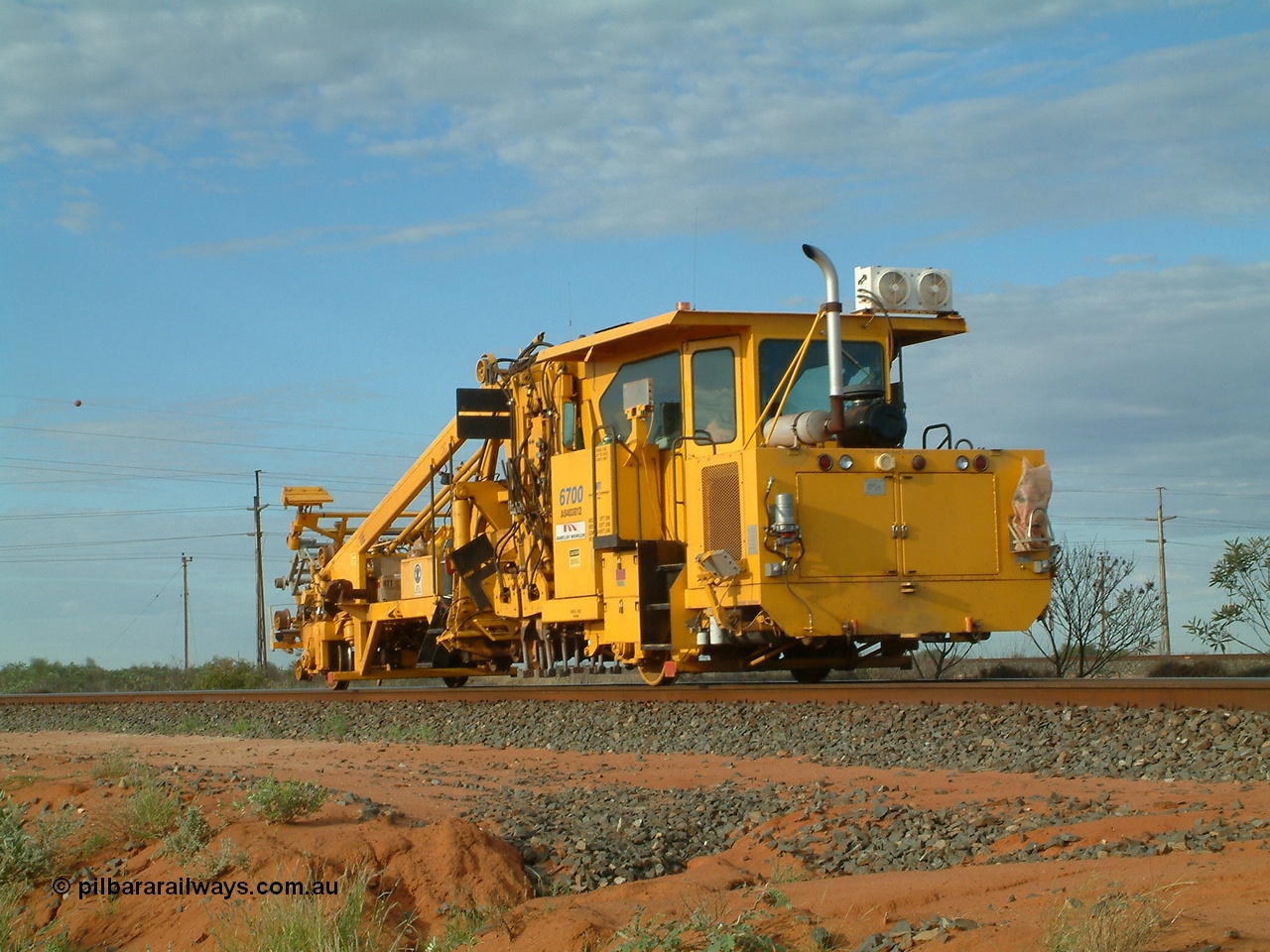 040407 073250
Goldsworthy Junction, Barclay Mowlem track tamper a Fairmont Jackson model 6700 production and switch tamper serial 153172, runs east along the Goldsworthy line. 7th April 2004.
Keywords: Jackson;6700;153172;track-machine;