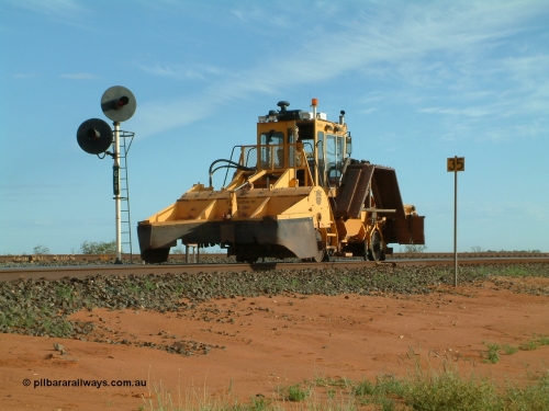 040407 073324
Goldsworthy Junction, Barclay Mowlem's R.E.L.A.M lease ballast plough, Knox Kershaw KBR 850 model travels east along the Goldsworthy line past the dual headed GJ 9 signal. 7th April 2004
Keywords: Knox-Kershaw;KBR-850;track-machine;