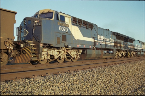 203-07
Bing Siding, BHP General Electric built AC6000 class leader 6070 'Port Hedland' serial 51062 in the passing track as second unit on a Yandi empty working.
Keywords: 6070;GE;AC6000;51062;