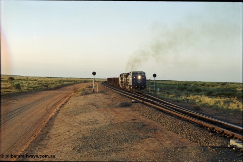 203-18
Bing Siding, with the empty clear, BHP General Electric AC6000 unit 6076 'Mt Goldsworthy' serial 51068 powers its' train out of the passing track at Bing South.
Keywords: 6076;GE;AC6000CW;51068;