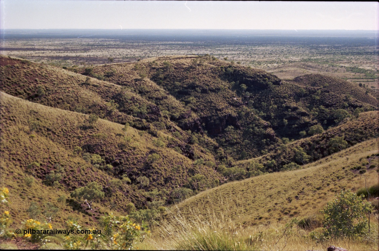 207-02
Koodaideri, view from saddleback looking north across the Fortescue Valley, Wittenoom - Roy Hill Rd can be seen if you know what to look for.
