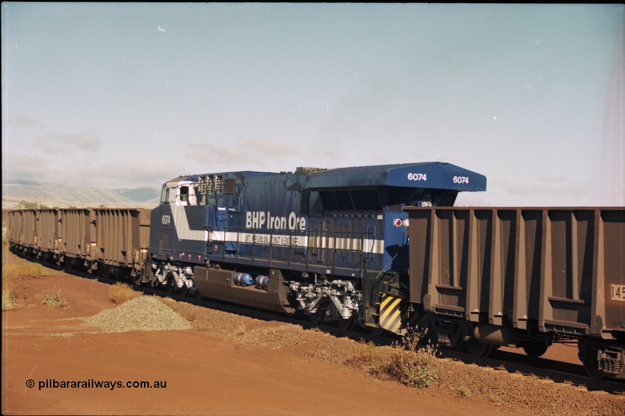 207-07
BHP General Electric built AC6000 unit 6074 serial 51066, brand new and unnamed at Yandi One load-out loop as a remote mid-train unit.
Keywords: 6074;GE;AC6000;51066;