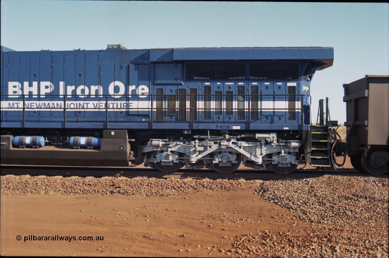 207-09
BHP General Electric built AC6000 unit 6074 serial 51066, brand new and unnamed at Yandi One load-out loop as a remote mid-train unit, the size of the extended radiator compared to domestic AC6000 units is evident here.
Keywords: 6074;GE;AC6000;51066;