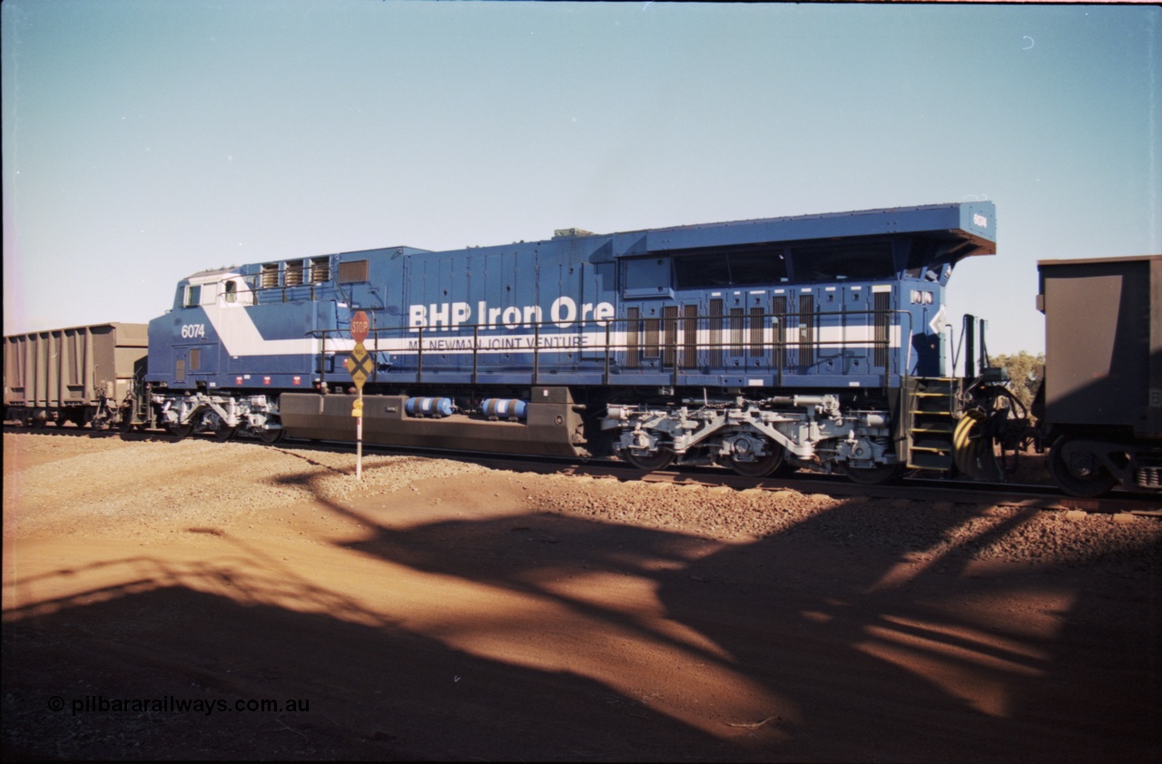 207-12
BHP General Electric built AC6000 unit 6074 serial 51066, brand new and unnamed at Yandi One load-out loop as a remote mid-train unit.
Keywords: 6074;GE;AC6000;51066;