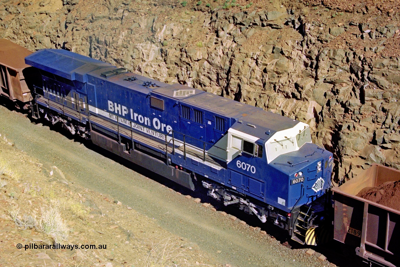 207-19
BHP General Electric built AC6000 unit 6071 serial 51063 brand new and unnamed on the loaded side of Yandi One load-out loop as a remote mid-train unit, showing roof view and the original style windscreen protectors.
Keywords: 6074;GE;AC6000;51066;