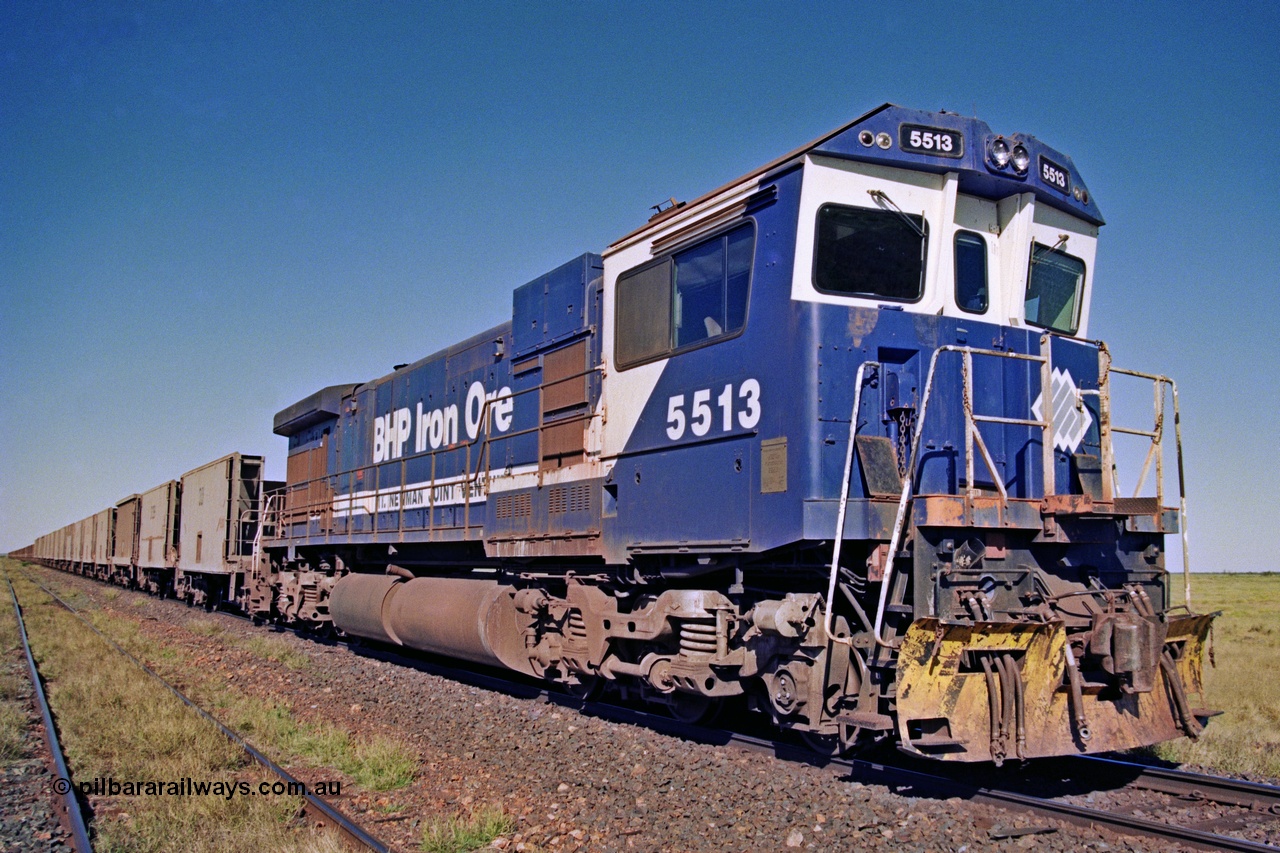 207-23
Hardie Siding, BHP locomotive 5513 is the final member of Goninan rebuilds from ALCo C636 5453 into a GE C36-7M unit 5513 serial 4839-02 / 88-078, with 'Kalgan' nameboards removed for fitting to AC6000 class 6074, holds the main with a loaded Yarrie train awaiting a cross.
Keywords: 5513;Goninan;GE;C36-7M;4839-02/88-078;rebuild;AE-Goodwin;ALCo;C636;5453;G6012-2;