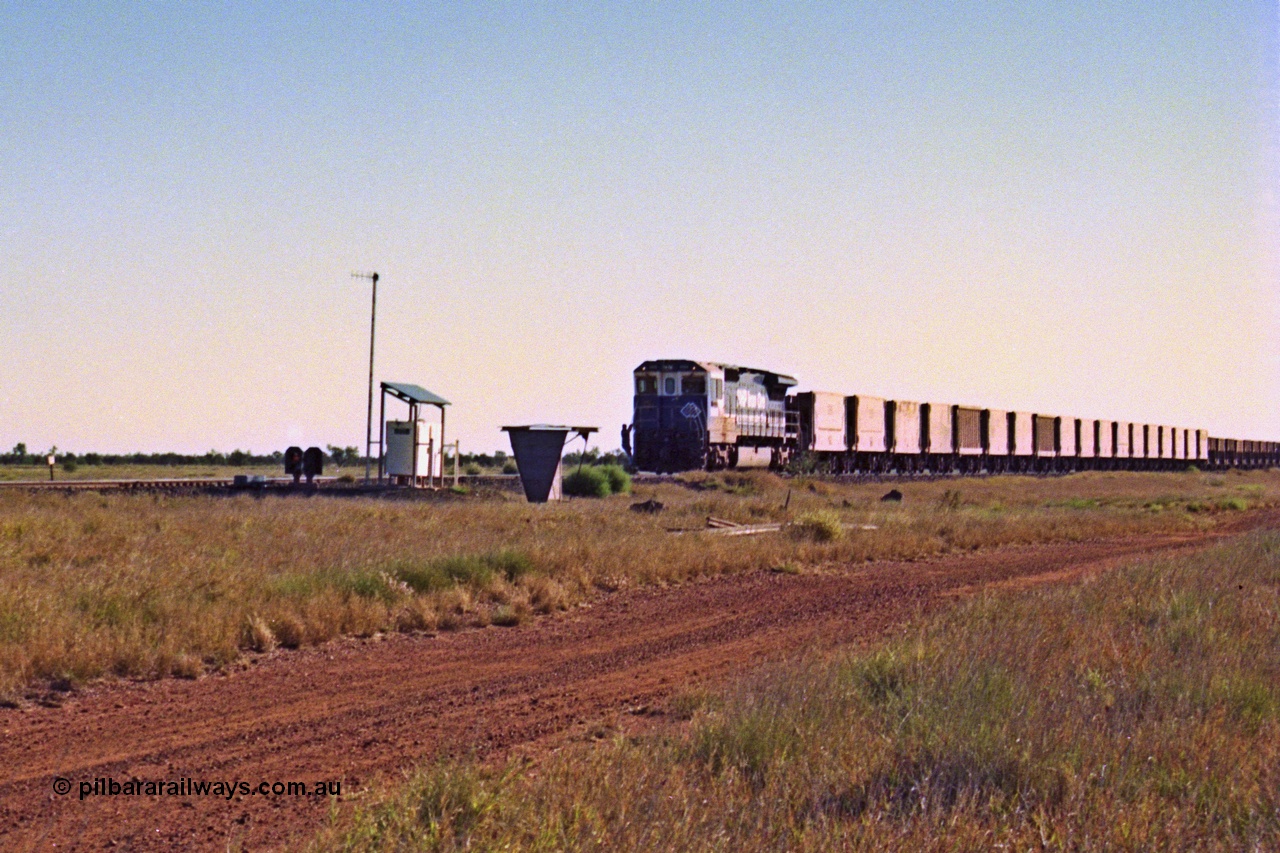 207-26
Hardie Siding, BHP unit 5669 'Builen' is the highest numbered CM40-8MEFI rebuild by Goninan, serial 8412-02 / 95-160, leading an empty train pauses to allow the 2nd person to alight and set the road for the passing track. 
Keywords: 5669;Goninan;GE;CM40-8EFI;8412-02/95-160;rebuild;Comeng-NSW;ALCo;M636C;5486;C6084-2;