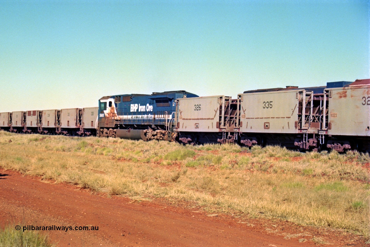 207-29
Hardie Siding, BHP Goninan GE rebuild CM40-8MEFI unit 5669 'Builen' serial 8412-02 / 95-160 runs down the passing track, USA built Gunderson smooth sided ore cars ex Phelps Dodge Copper Mine.
Keywords: 5669;Goninan;GE;CM40-8EFI;8412-02/95-160;rebuild;Comeng-NSW;ALCo;M636C;5486;C6084-2;