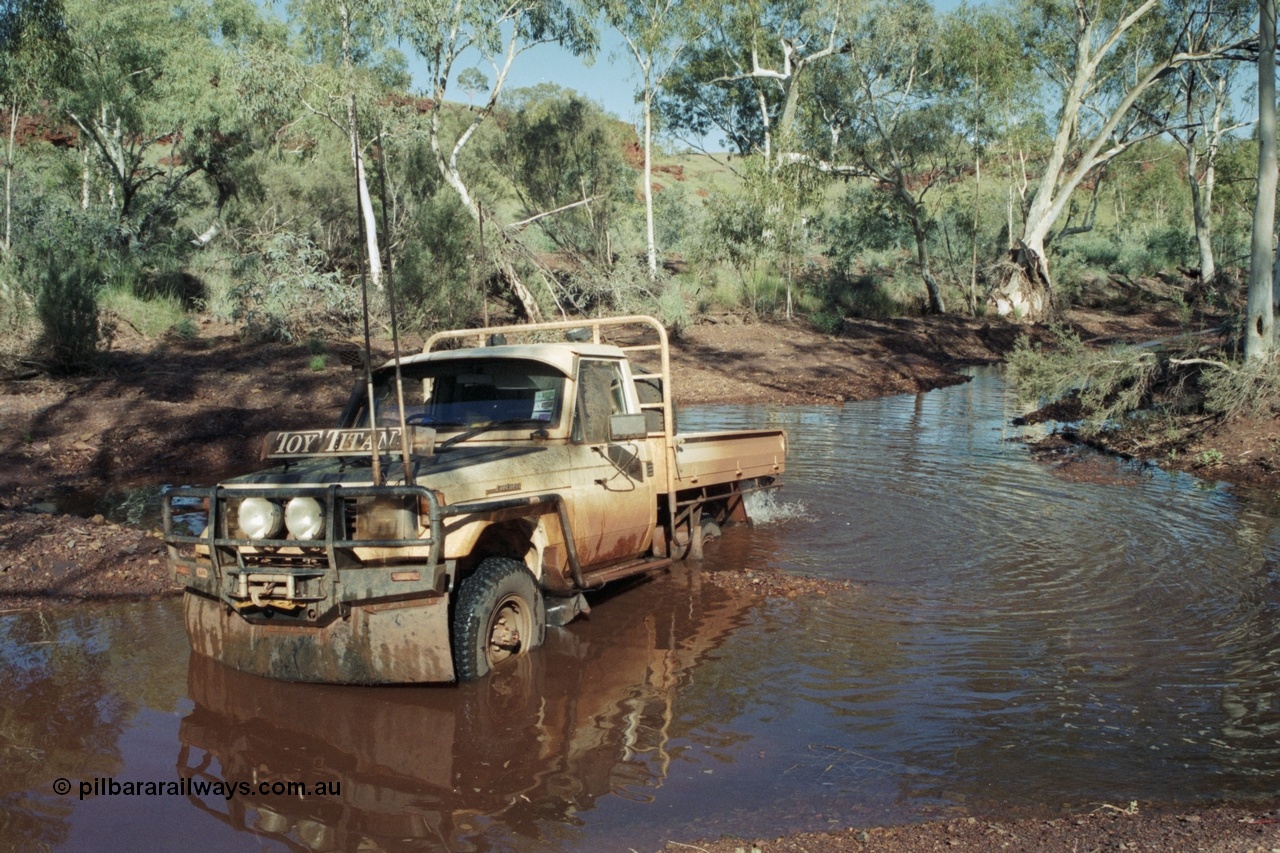 218-01
Yandi, river access road that runs between Roy Hill Rd and Yandi Junction, sort of following the train line, Toyota Land Cruiser Toy Titan, 1994 HJ75 series tray back.
