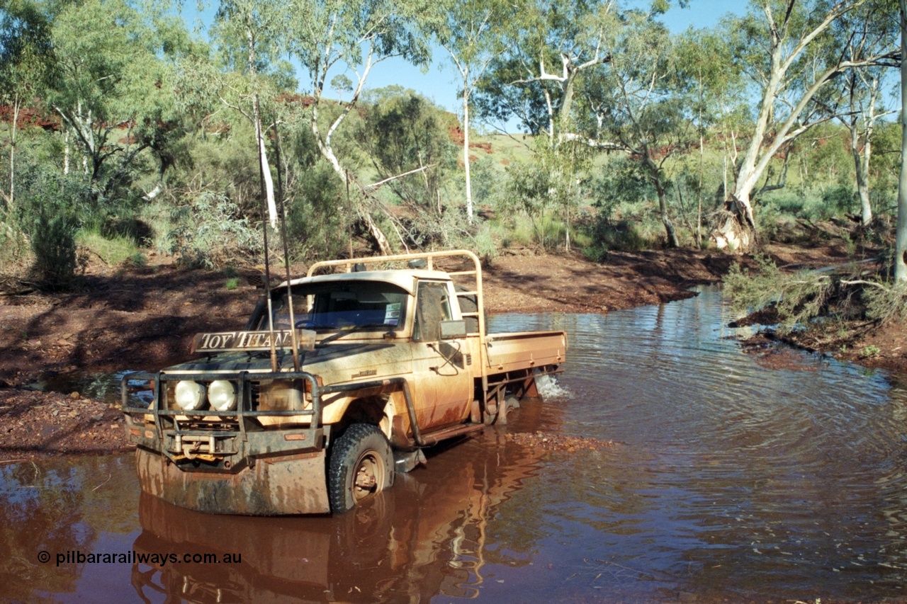 218-02
Yandi, river access road that runs between Roy Hill Rd and Yandi Junction, sort of following the train line, Toyota Land Cruiser Toy Titan, 1994 HJ75 series tray back.
