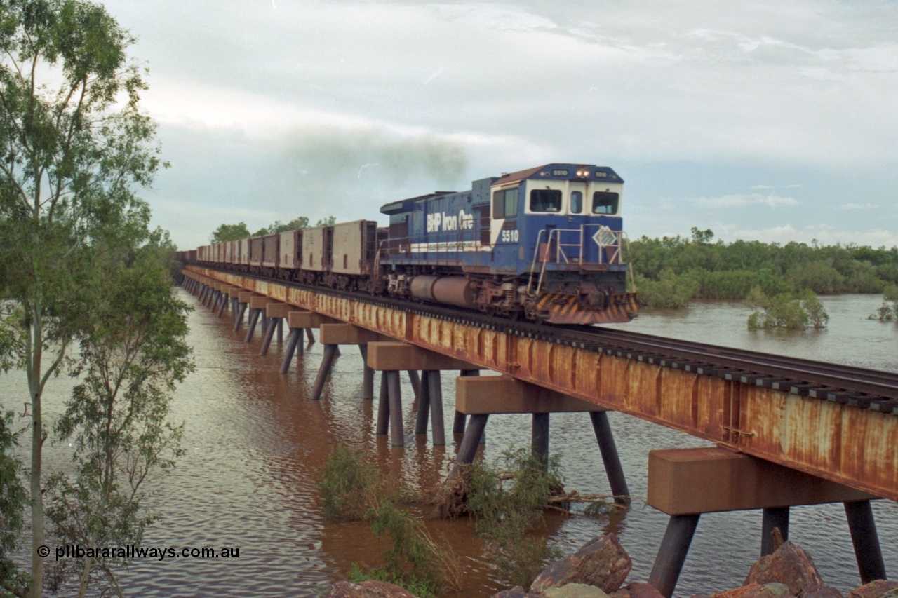 218-11
De Grey River Bridge, a loaded Yarrie train crosses the river behind an original Mt Newman Mining ALCo to GE rebuild carried out by Goninan, originally ALCo C636 5458 to GE model C36-7M unit 5510 'Newman' serial 4839-07 / 87-075.
Keywords: 5510;Goninan;GE;C36-7M;4839-07/87-075;rebuild;AE-Goodwin;ALCO;C636;5458;G6027-2;