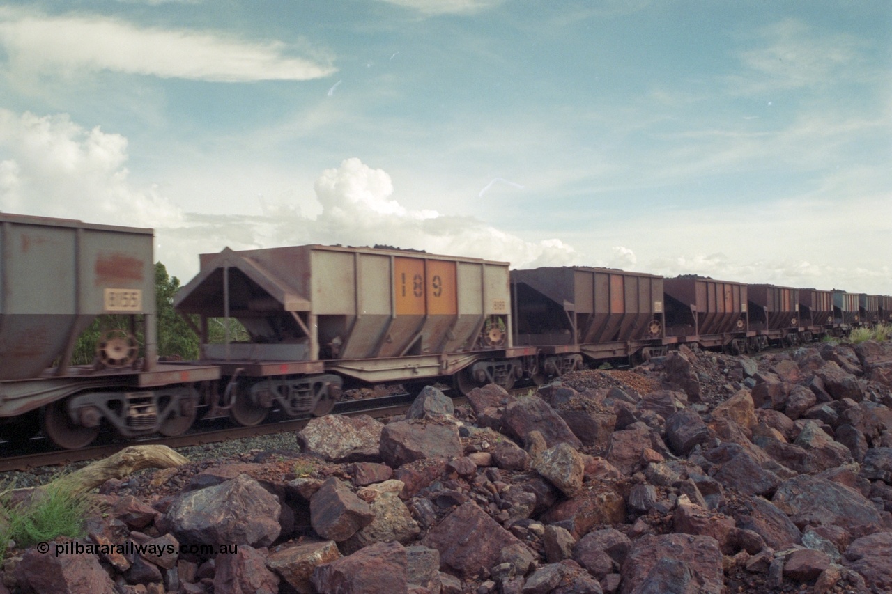 218-16
De Grey River Bridge, a loaded GML train with the original AE Goodwin designed and Tomlinson Steel Perth and Scotts of Ipswich built waggons.
