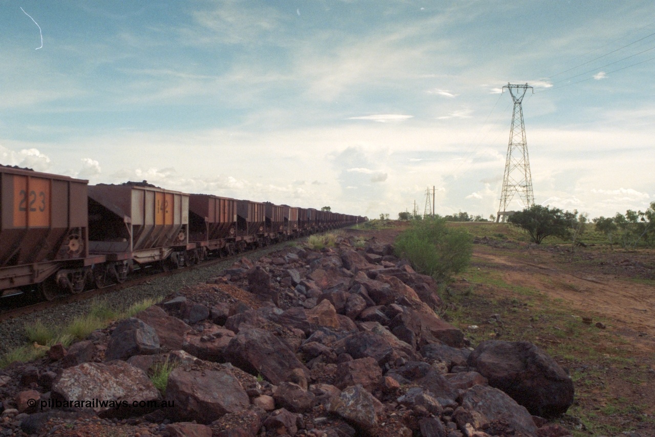 218-17
De Grey River Bridge, a loaded GML train with the original AE Goodwin designed and Tomlinson Steel Perth and Scotts of Ipswich built waggons.
