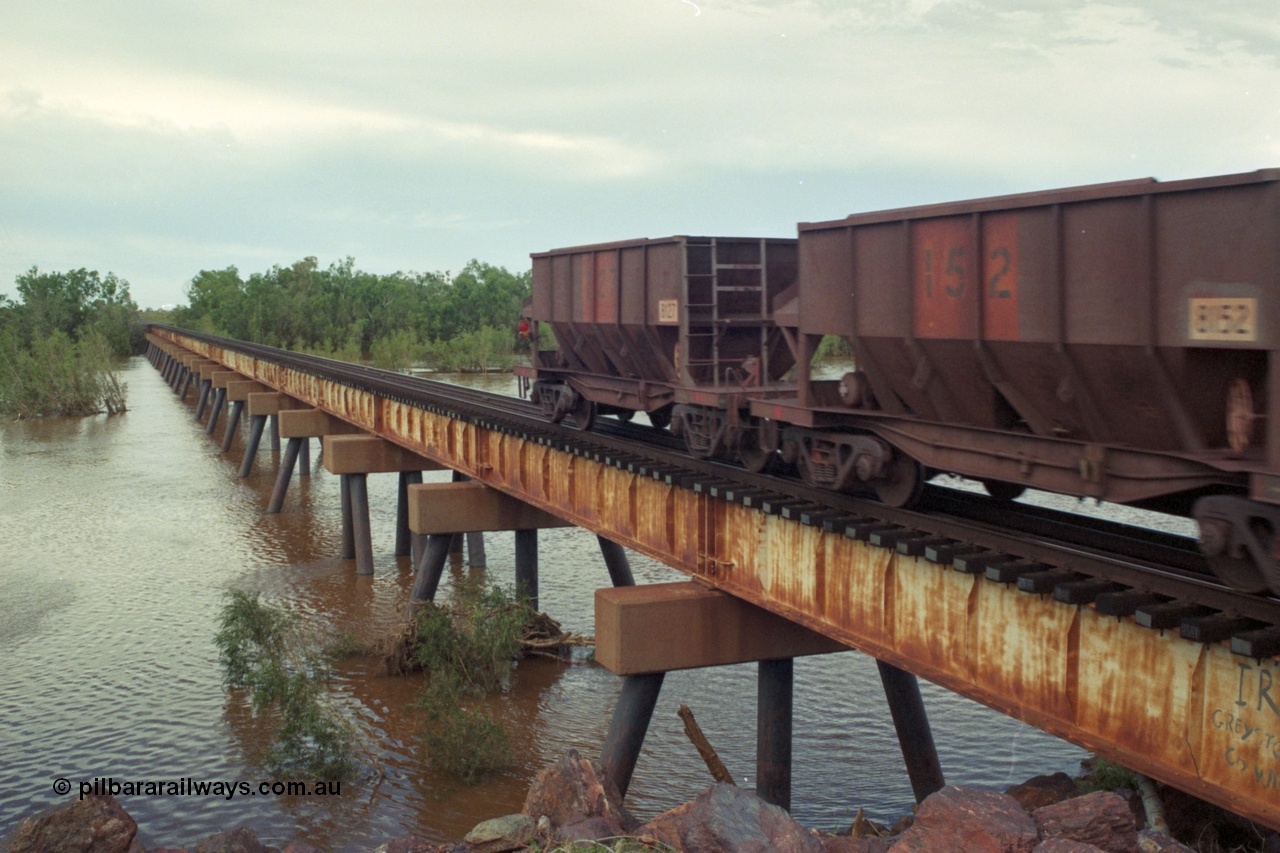 218-18
De Grey River Bridge, a loaded GML train with the original AE Goodwin designed and Tomlinson Steel Perth and Scotts of Ipswich built waggons.
