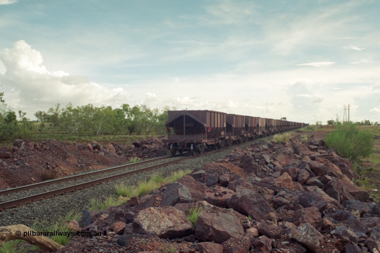 218-19
De Grey River Bridge, a loaded GML train with the original AE Goodwin designed and Tomlinson Steel Perth and Scotts of Ipswich built waggons.
