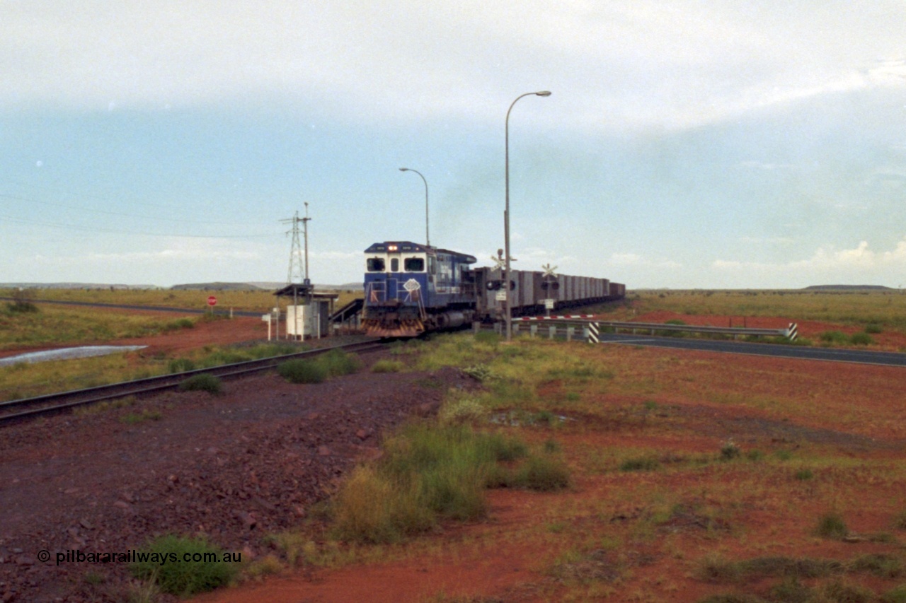 218-23
De Grey, Great Northern Highway grade crossing at the 57.15 km a loaded GML train behind an original Mt Newman Mining ALCo C636 5458 to GE C36-7M rebuild carried out by Goninan unit 5510 'Newman' serial 4839-07 / 87-075.
Keywords: 5510;Goninan;GE;C36-7M;4839-07/87-075;rebuild;AE-Goodwin;ALCO;C636;5458;G6027-2;