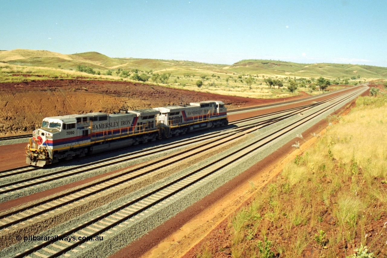 218-27
Yandicoogina or HIY as Hamersley Iron identify it, located 445 km from Parker Point yard in Dampier. Bank engine units General Electric Dash 9-44CW models 7090 serial 47769 and 7089 idle away waiting their next loaded train to push out.
Keywords: 7090;GE;Dash-9-44CW;47769;