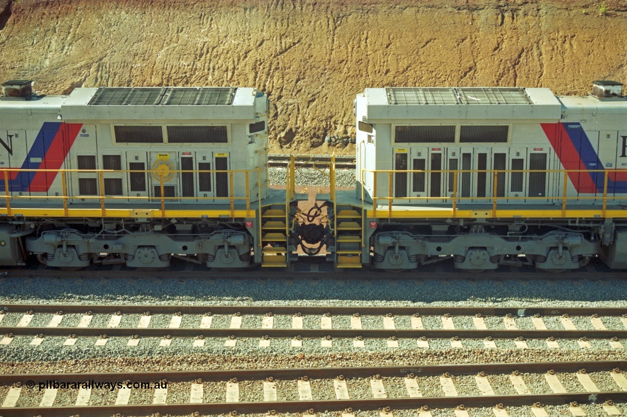 218-34
Yandicoogina or HIY as Hamersley Iron identify it, located 445 km from Parker Point yard in Dampier. Bank engine units General Electric Dash 9-44CW models 7089 serial 47768 on the right coupled to 7090 serial 47769 shows the radiator section and bogies of both units.
Keywords: 7090;GE;Dash-9-44CW;47769;