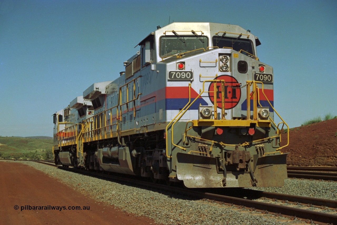 219-03
Yandicoogina or HIY as Hamersley Iron identify it, located 445 km from Parker Point yard in Dampier. Bank engine units General Electric Dash 9-44CW models 7090 serial 47769 and 7089 idle away waiting their next loaded train to push out.
Keywords: 7090;GE;Dash-9-44CW;47769;