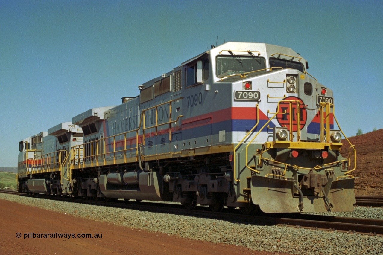 219-04
Yandicoogina or HIY as Hamersley Iron identify it, located 445 km from Parker Point yard in Dampier. Bank engine units General Electric Dash 9-44CW models 7090 serial 47769 and 7089 idle away waiting their next loaded train to push out.
Keywords: 7090;GE;Dash-9-44CW;47769;