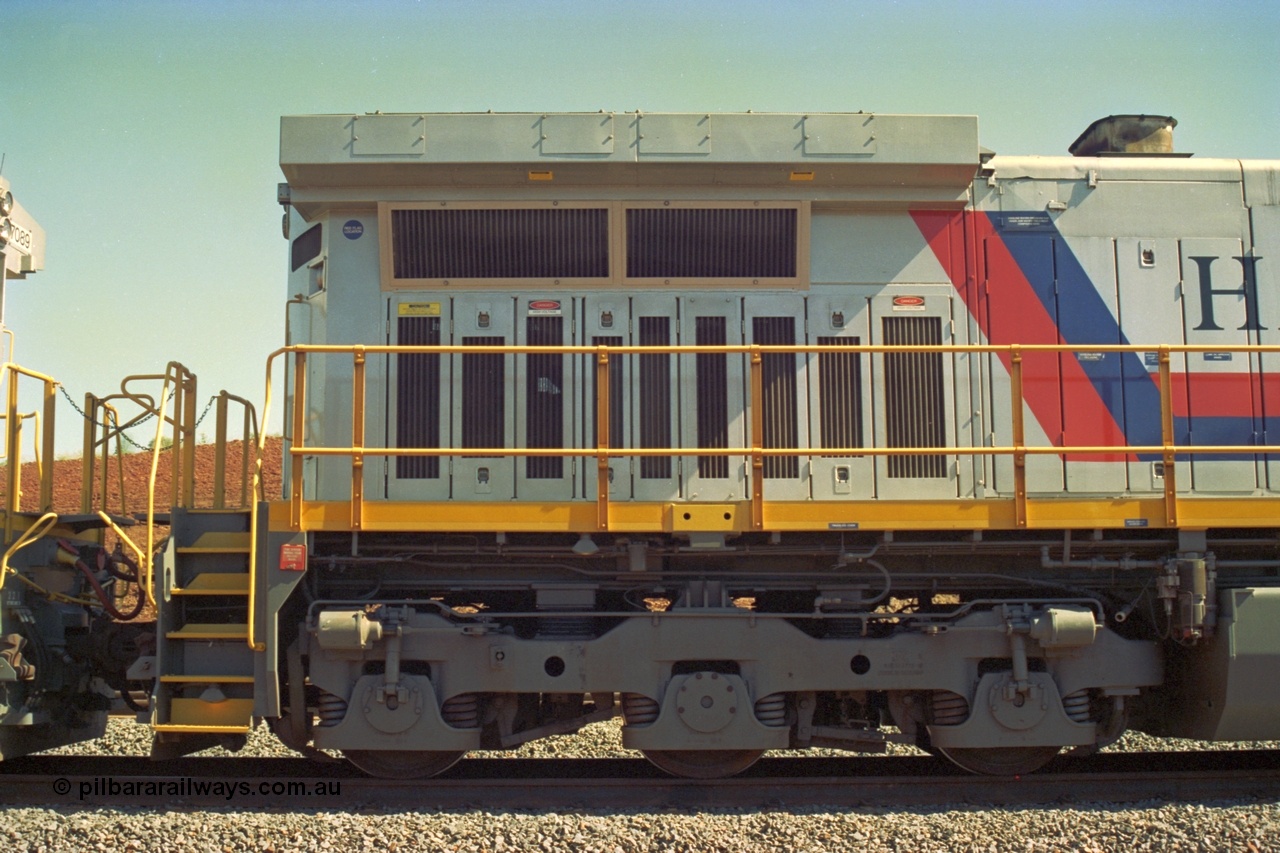 219-08
Yandicoogina or HIY as Hamersley Iron identify it, located 445 km from Parker Point yard in Dampier. Bank engine unit General Electric Dash 9-44CW model 7090 serial 47769 view of radiator and rear bogie, coupled to 7089. In the original 'Pepsi Can' livery as delivered.
Keywords: 7090;GE;Dash-9-44CW;47769;