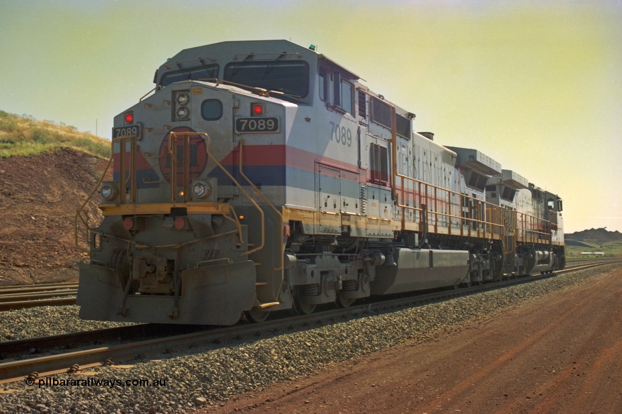 219-13
Yandicoogina or HIY as Hamersley Iron identify it, located 445 km from Parker Point yard in Dampier. Bank engine units General Electric Dash 9-44CW models 7089 serial 47768 and 7090 idle away waiting their next loaded train to push out, the mine is visible in the background.
Keywords: 7089;GE;Dash-9-44CW;47768;