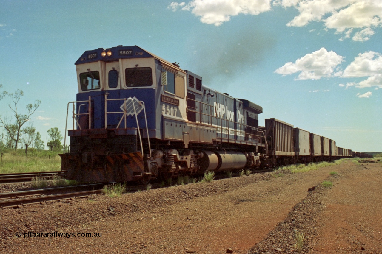 219-29
Goldsworthy Siding, C36-7M unit 5507 'Nimingarra' serial 4839-03 / 87-072, an original Mt Newman Mining ALCo C636 5461 to GE C36-7M rebuild carried out by Goninan, leads an empty train along the siding at Goldsworthy.
Keywords: 5507;Goninan;GE;C36-7M;4839-03/87-072;rebuild;AE-Goodwin;ALCo;C636;5461;G6035-2;