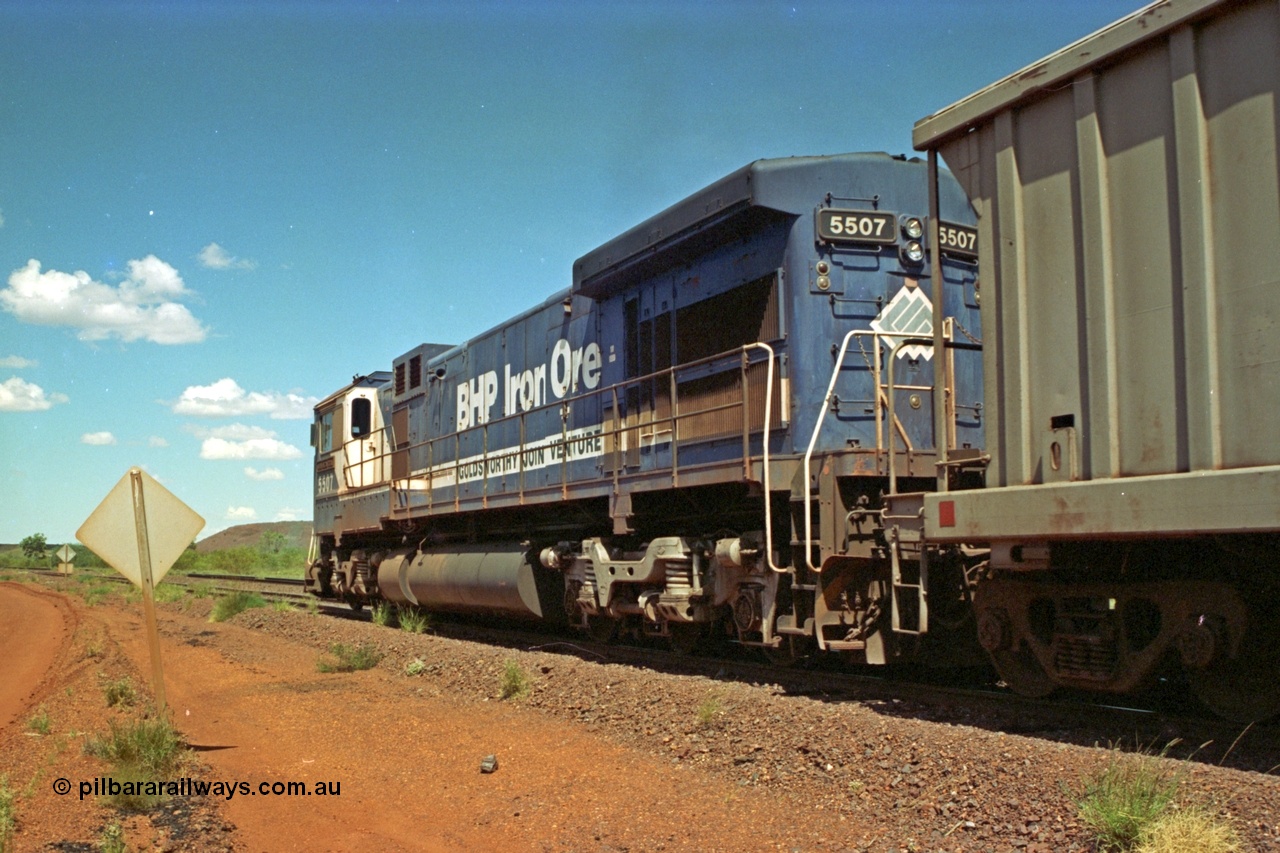 219-30
Goldsworthy Siding, C36-7M unit 5507 'Nimingarra' serial 4839-03 / 87-072, an original Mt Newman Mining ALCo C636 5461 to GE C36-7M rebuild carried out by Goninan, leads an empty train along the siding at Goldsworthy to cross a loaded.
Keywords: 5507;Goninan;GE;C36-7M;4839-03/87-072;rebuild;AE-Goodwin;ALCo;C636;5461;G6035-2;